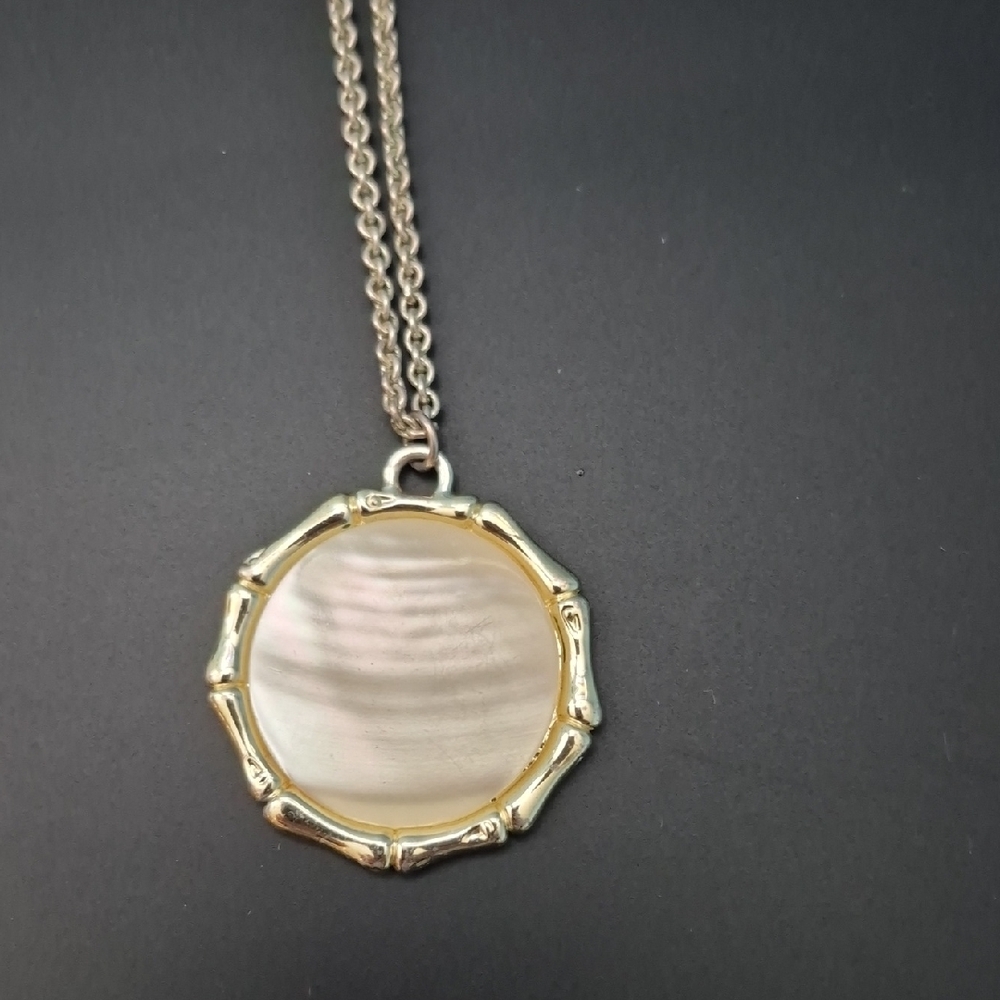 Elegant Gold and Silver Pendant Necklace